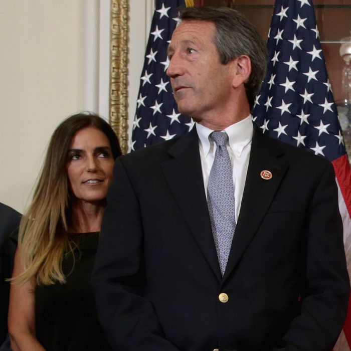 WASHINGTON, DC - MAY 15: U.S. Rep. Mark Sanford (R-SC) (R) and his fiance Maria Belen Chapur wait for Speaker of the House John Boehner (R-OH) for a ceremonial swearing-in at the U.S. Capitol May 15, 2013 in Washington, DC. The former governor of South Carolina, Sanford won a special election on May 7 to win the seat vacated by Republican Tim Scott, who was appointed to the Senate. Sanford has returned to politics after his public service career was derailed in 2009 by an extramarital affair with Chapur that cost him his marriage. (Photo by Chip Somodevilla/Getty Images)