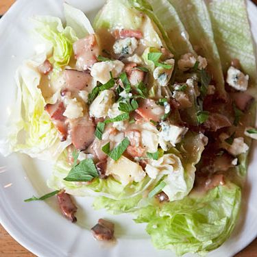 Iceberg wedge with warm bacon dressing and bleu cheese