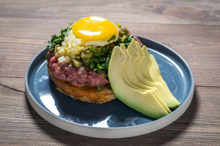 Beef-tartare burger with avocado, scallions, capers, and Savora mustard.