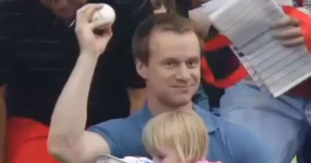 Dad Effortlessly Catches Foul Ball With One Hand While Holding Daughter