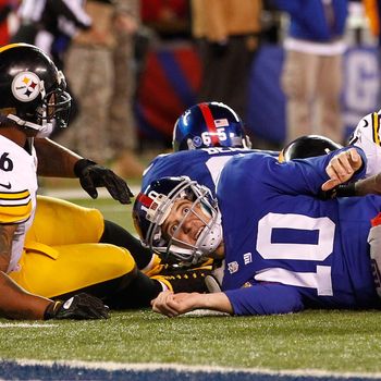 Eli Manning #10 of the New York Giants looks for a call after being taken down by LaMarr Woodley #56 of the Pittsburgh Steelers during their game at MetLife Stadium on November 4, 2012 in East Rutherford, New Jersey. 
