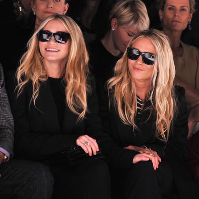 Ashley Olsen and Mary-Kate Olsen attend the J. Mendel Fall 2012 fashion show during Mercedes-Benz Fashion Week at The Theatre at Lincoln Center on February 15, 2012 in New York City.