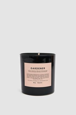 Boy Smells Scented Candle in Gardener