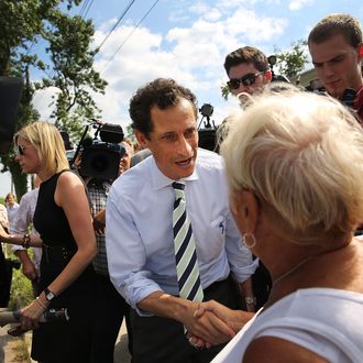 Anthony Weiner, a leading candidate for New York City mayor, speaks with residents in Staten Island on a visit to homes damaged by Hurricane Sandy on July 26, 2013 in New York City. It was recently revealed that Weiner engaged in lewd online conversations with a woman after he resigned from Congress for similar previous incidents. 