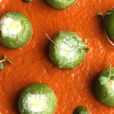 mozzarella-roasted gnocchi with arugula, basil pesto, and roasted tomato sauce