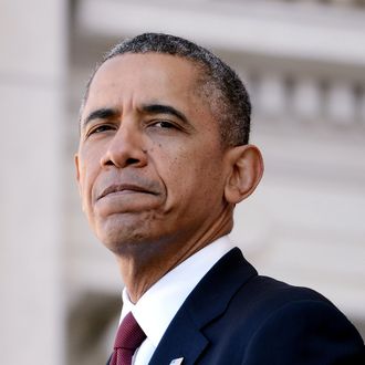 ARLINGTON, VA - NOVEMBER 11: (AFP OUT) U.S. President Barack Obama speaks during a ceremony on Veterans Day at Arlington National Cemetery on November 11, 2013 in Arlington, Virginia. For Veterans Day, President Obama is paying tribute to military veterans past and present who have served and sacrificed their lives for their country. (Photo by Olivier Douliery-Pool/Getty Images)