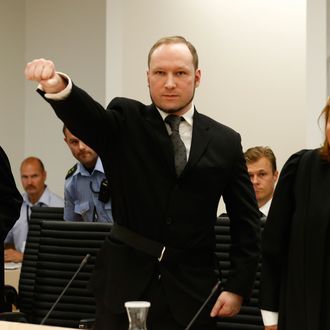Self confessed mass murderer Anders Behring Breivik raises his fist in a right wing salute on arrival court room 250 at Oslo central court on August 24, 2012 to be sentenced for his twin attacks last year that left 77 people dead, bringing to a close one of the most spectacular trials in Norway's history. Breivik has admitted killing 77 people in the attacks that traumatised Norway and shocked the world, claiming eight victims in an Oslo blast and taking 69 more lives, mostly teenagers', in a shooting frenzy at an island summer camp. 