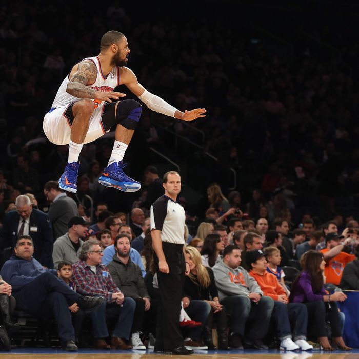 Tyson Chandler #6 of the New York Knicks stretches his legs prior to the game against the Phoenix Suns at Madison Square Garden on December 2, 2012 in New York City. 