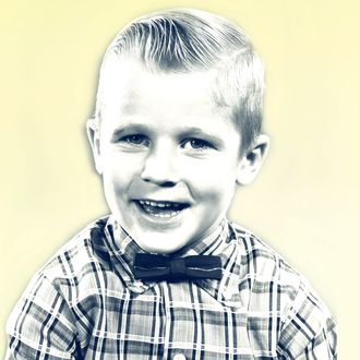 1950s smiling blond boy wearing plaid shirt bow ties looking at camera