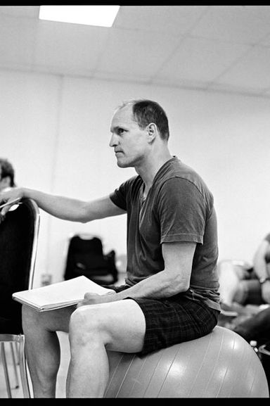 Harrelson directs from atop a birthing ball at an early rehearsal.