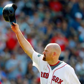 FILE - In this June 24, 2012, file photo, Boston Red Sox's Kevin Youkilis tips his helmet as he comes off the field after hitting a triple and being replaced with a pinch runner in the seventh inning of a baseball game against the Atlanta Braves in Boston.