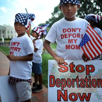 Young boys stand across the street from the White House to participate in a 