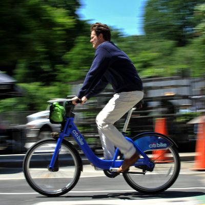 A man rides a Citi Bike bicycle near Union Square as the bike sharing system is launched May 27, 2013 in New York. About 330 stations in Manhattan and Brooklyn will have thousands of bicycles for rent. 