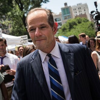 NEW YORK, NY - JULY 08: Former New York Gov. Eliot Spitzer collects signatures from citizens to run for comptroller of New York City on July 8, 2013 in New York City. Spitzer resigned as governor in 2008 after it was discovered that he was using a high end call girl service. (Photo by Andrew Burton/Getty Images)