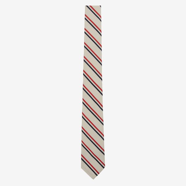 Thom Browne White Silk Tricolor Tie a white silk tie with thin navy and red stripes 48 Things on Sale You’ll Actually Want to Buy: From Sunday Riley to Patagonia - The Strategist