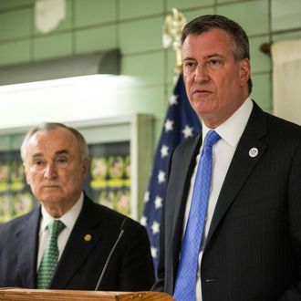 New York City Mayor Bill DeBlasio (R) and New York Police Department Commissioner Bill Bratton speak at a press conference at the NYPD's 25th Precinct on February 27, 2014 in New York City. Mayor Bill DeBlasio and Commissioner Bratton spoke to the officers and held a press conference after an officer was shot in the leg in the Crown Heights neighborhood of Brooklyn, yesterday. 