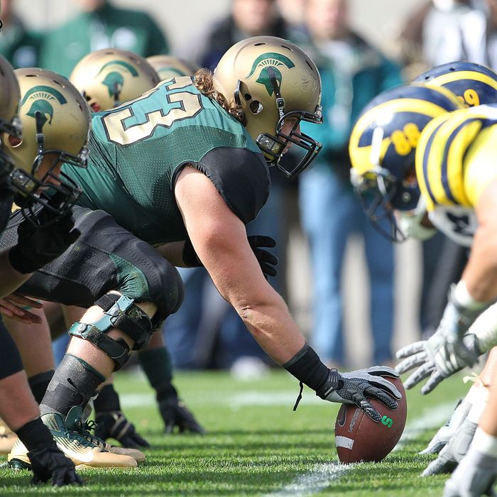 EAST LANSING, MI - OCTOBER 15: Travis Jackson #62 of the Michigan State Spartans gets ready to snap the ball during the game against the Michigan Wolverines at Spartan Stadium on October 15, 2011 in East Lansing, Michigan. Michigan State defeated Micigan 28-14. (Photo by Leon Halip/Getty Images)