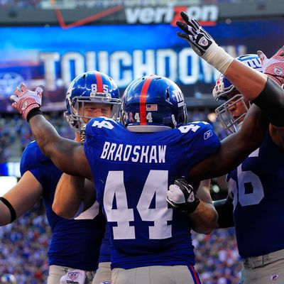 EAST RUTHERFORD, NJ - OCTOBER 16: Ahmad Bradshaw #44 of the New York Giants celebrates a one yard touchdown with his teammates in the third quarter against the Buffalo Bills at MetLife Stadium on October 16, 2011 in East Rutherford, New Jersey. (Photo by Chris Trotman/Getty Images)