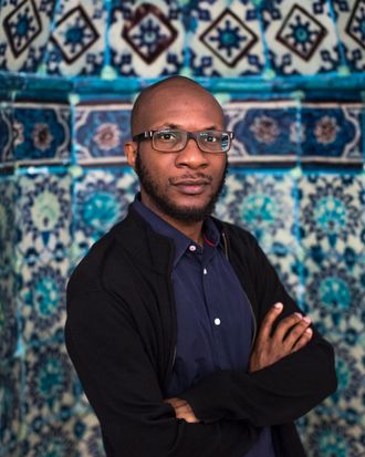 HEBRON - WEST BANK - JUNE 3: Nigerian-American writer Teju Cole poses for a portrait inside the Ibrahimi mosque or Tomb of the Patriarchs during a 2014 Palestine Festival of Literature tour on June 3, 2014 in Hebron, West Bank. The festival is an annual event that aims to bring a cultural festival of international standard to audiences in Palestine to assert 