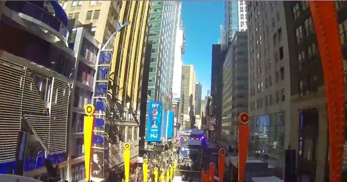 Adults Using Super Bowl As an Excuse to Ride Giant Slide in Times Square