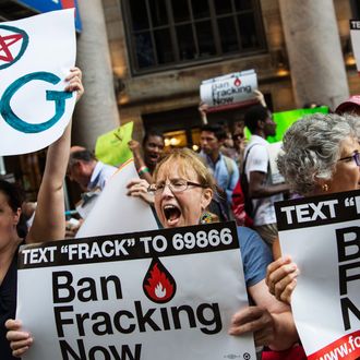 NEW YORK, NY - JUNE 30: Protesters demand a statewide ban on hydraulic fracturing, a controversial technique for removing oil and natural gas from the earth also known as 'fracking,' on June 30, 2014 in New York City. The protest was held outside a Democratic party event with New York Governor Andrew Cuomo attending. (Photo by Andrew Burton/Getty Images)