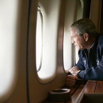 US President George W. Bush looks out the window of Air Force One 31 August, 2005, as he flies over New Orleans, Louisiana, surveying the damage left by Hurricane Katrina. Returning to Washington from Texas, Air Force One descended to about 5000 feet (1500 meters) to allow Bush to view some of the worst damage from Hurricane Katrina, which ravaged the Gulf Coast states of Louisiana, Alabama and Mississippi on 29 August. 