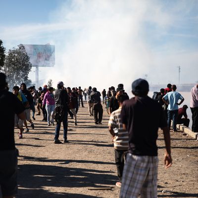 Migrants face tear gas from U.S. Border Patrol agents at San Ysidro.
