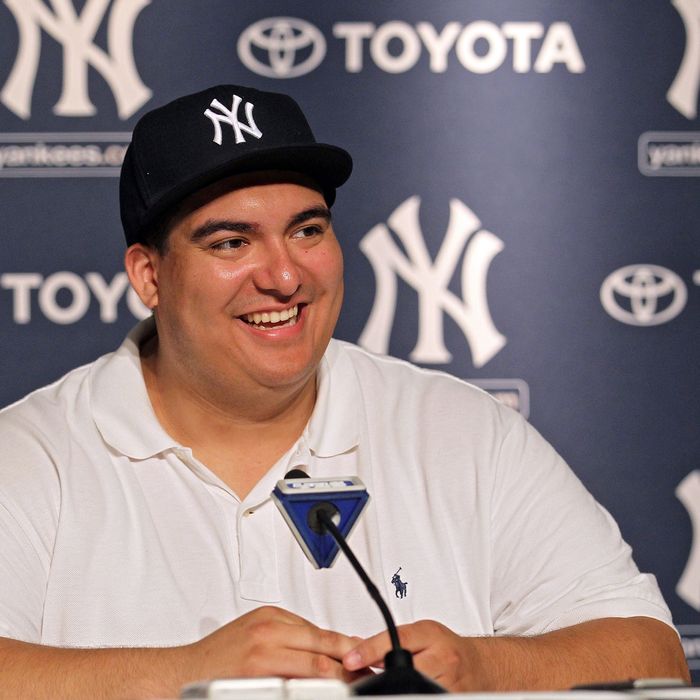 NEW YORK, NY - JULY 09: New York Yankees fan Christian Lopez speaks to the media after catching a home run which was the 3000th hit of Derek Jeter career at Yankee Stadium on July 9, 2011 in the Bronx borough of New York City. (Photo by Nick Laham/Getty Images)