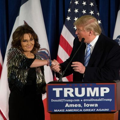 Donald Trump shakes hands with Sarah Palin on January 19, 2016 in Ames, IA. Trump received Palin's endorsement at the event. 