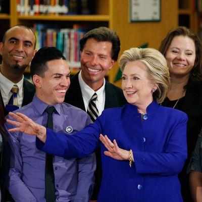 Democratic presidential candidate Hillary Rodham Clinton, center, speaks while posing for photos at an event at Rancho High School Tuesday, May 5, 2015, in Las Vegas. 