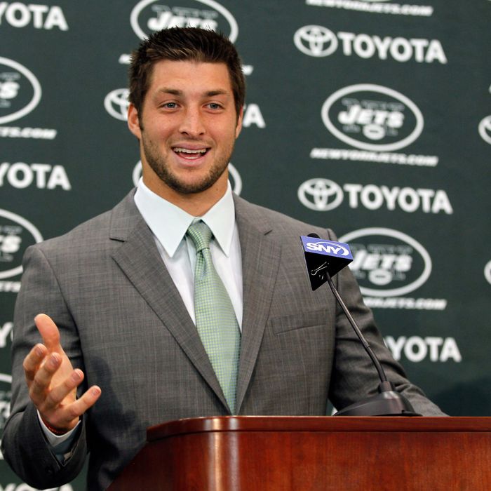 Quarterback Tim Tebow addresses the media as he is introduced as a New York Jet at the Atlantic Health Jets Training Center on March 26, 2012 in Florham Park, New Jersey.