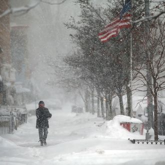 A woman walks through the snow on February 13, 2014 in the Brooklyn borough of New York City. In what is turning out to be one of the snowiest winter's in recent memory for New York City and much of the East Coast, Thursday's weather is expected to bring a wintery mix of sleet and snow with total accumulation of 6 to 8 inches of snow before ending early Friday morning.