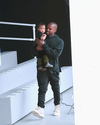 Kanye West with his very own toddler, North West.