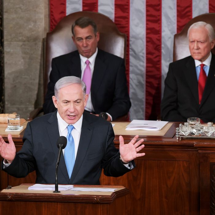 Israel's Prime Minister Benjamin Netanyahu addresses a joint session of the US Congress on March 3, 2015 at the US Capitol in Washington, DC. Netanyahu was invited by House Speaker John Boehner to address Congress without informing the White House. Looking on are House Speaker John Boehner(L) and President pro tempore of the Senate Sen. Orrin Hatch. AFP PHOTO / MANDEL NGAN (Photo credit should read MANDEL NGAN/AFP/Getty Images)