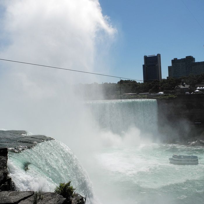 A tourist ship in Niagara Falls, New York, on June 14, 2012, passes under the tight rope which will be used by high-wire walker Nik Wallenda, 33, on June 15 to cross from the US to Canada over the Horseshoe section of the falls. The wire is 1,550 feet (472 meters) long. Wallenda will be suspended 173 feet (53 meters) above the falls. 