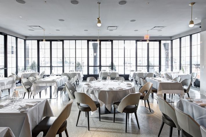 The sleek dining room in gray and white.