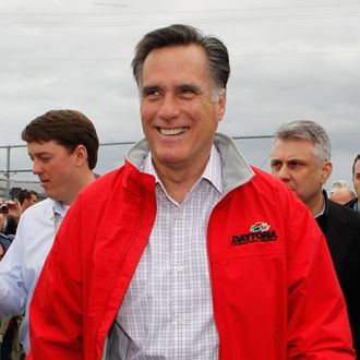 Republican presidential candidate, former Massachusetts Gov. Mitt Romney walks in the garage area prior to the start of the NASCAR Sprint Cup Series Daytona 500
