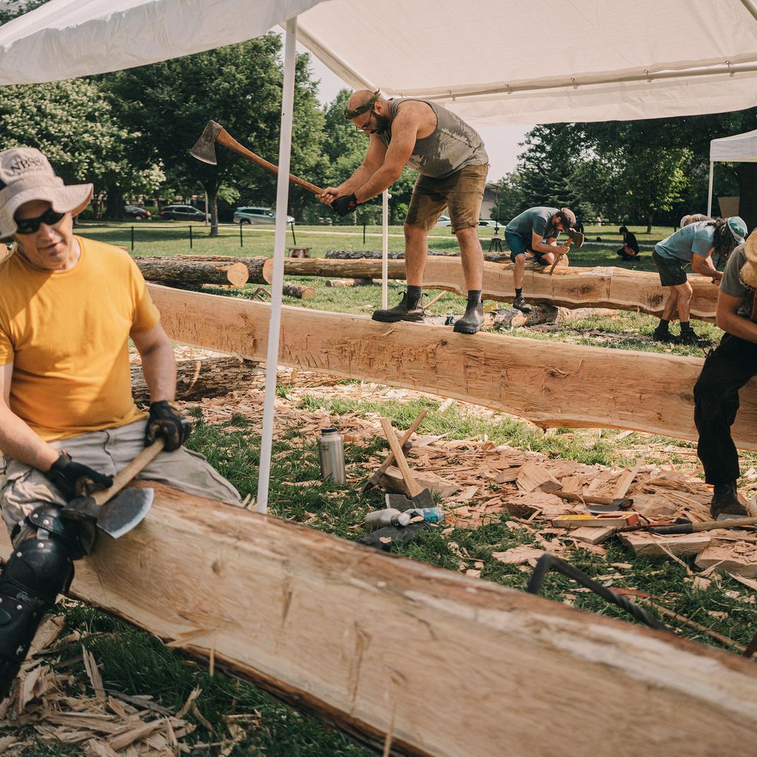 <p>Carpenters and volunteers, including Hank Silver of Massachusetts, center, at work.</p>