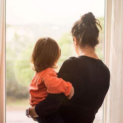 Woman holding baby.