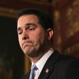 MADISON, WI - FEBRUARY 23: Wisconsin Governor Scott Walker speaks to the press outside his office at the Wisconsin State Capitol on February 23, 2011 in Madison, Wisconsin. Protestors have occupied the State Capitol building for the past nine days while the governor has tried to push through a bill that would restrict collective bargaining for most government workers. (Photo by Scott Olson/Getty Images) *** Local Caption *** Scott Walker