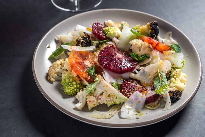 Charred-cauliflower salad with blood orange, mint, and hot peppers.