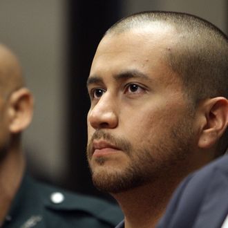 SANFORD, FL - APRIL 12: George Zimmerman (C) appears for a bond hearing at the John E. Polk Correctional Facility April 12, 2012 in Sanford, Florida. Zimmerman was charged yesterday with second degree murder in the fatal shooting of 17-year-old Trayvon Martin who died February 26, 2012. (Photo by Gary Green/The Orlando Sentinel-Pool/Getty Images)