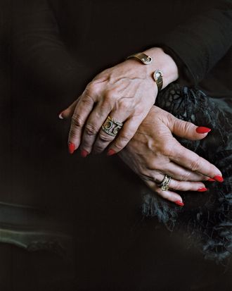 One woman’s jewelry includes a double-C Cartier bracelet-and-ring set.