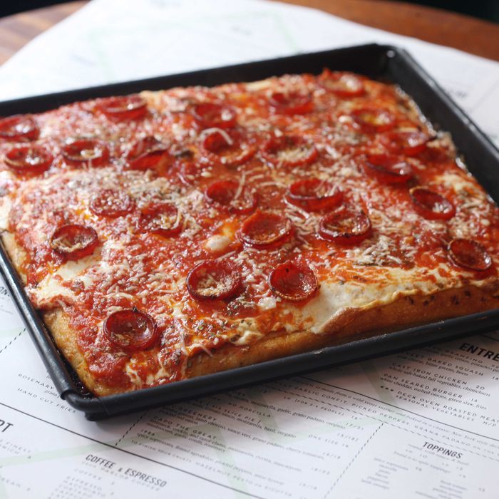 The square grandma-style pizza, with tomato sauce, mozzarella, basil, and oregano.