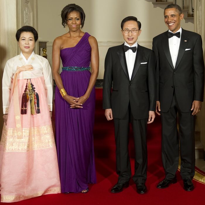 Michelle Obama with South Korean President Lee Myung-bak and First Lady Kim Yoon-ok. Oh and Barack! Don't forget that he attended in an outfit as well.