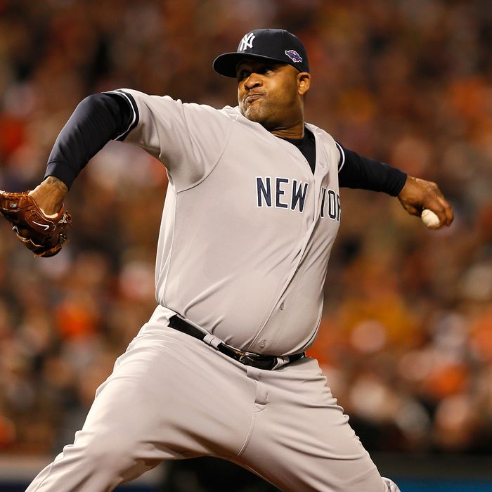 CC Sabathia #52 of the New York Yankees throws a pitch against the Baltimore Orioles during Game One of the American League Division Series at Oriole Park at Camden Yards on October 7, 2012 in Baltimore, Maryland.