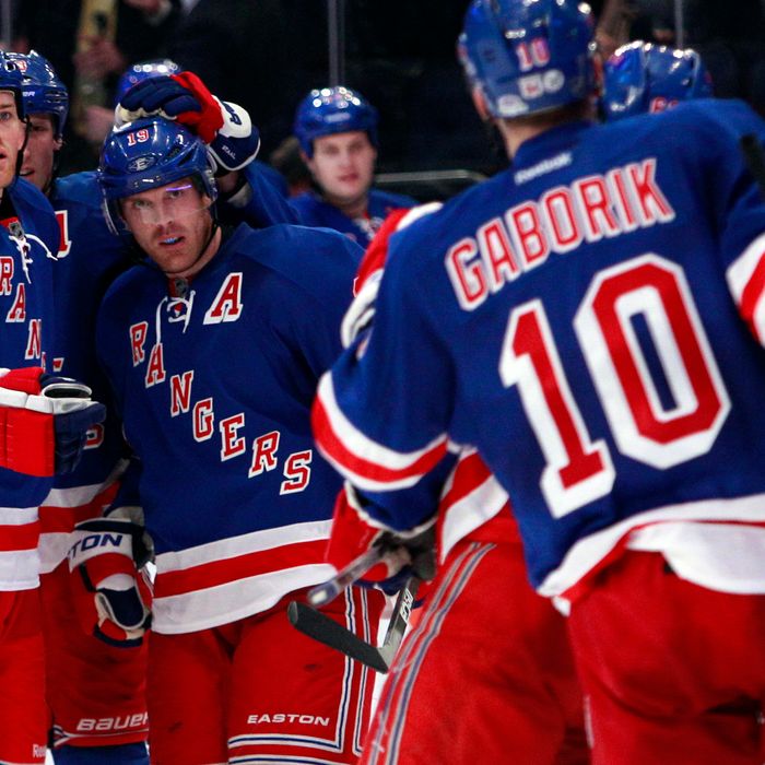New York Rangers' Brad Richards, second from left, celebrates with teammates after scoring a goal during the second period of an NHL hockey game against the Carolina Hurricanes Tuesday, March 13, 2012, in New York. 