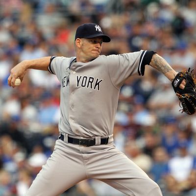 KANSAS CITY, MO - AUGUST 15: Starting pitcher A.J. Burnett #34 of the New York Yankees pitches during the game against the Kansas City Royals at Kauffman Stadium on August 15, 2011 in Kansas City, Missouri. (Photo by Jamie Squire/Getty Images)