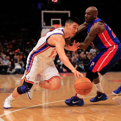 Jeremy Lin #17 of the New York Knicks drives past Detroit Pistons Walker Russell #23 of the Detroit Pistons at Madison Square Garden on January 31, 2012 in New York City.