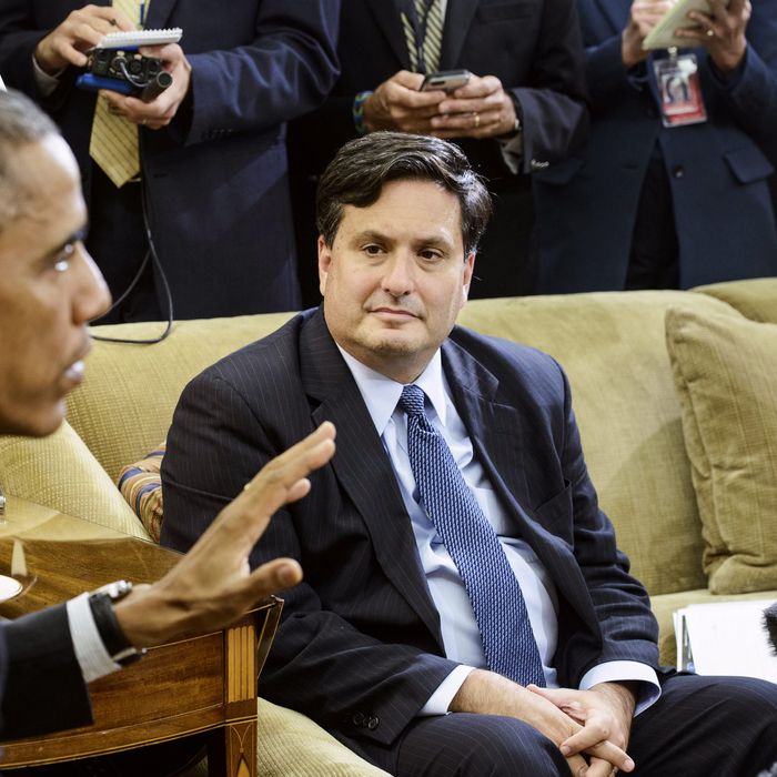 Ebola response coordinator Ron Klain (R) listens while US President Barack Obama makes a statement to the press on the Canadian Parliament shooting after their meeting in the Oval Office of the White House October 22, 2014 in Washington, DC. 